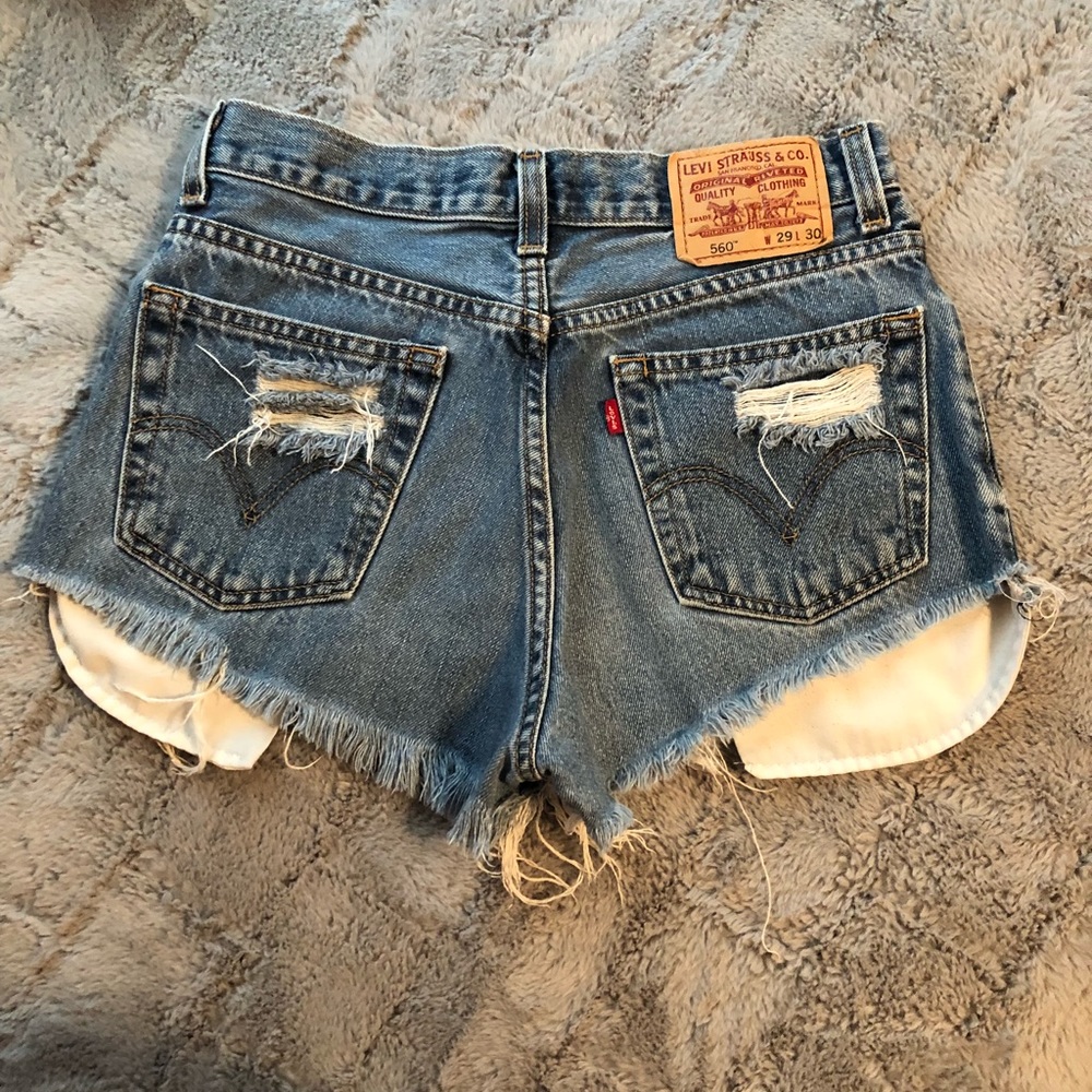 Vintage distressed Levi’s denim high waist shorts